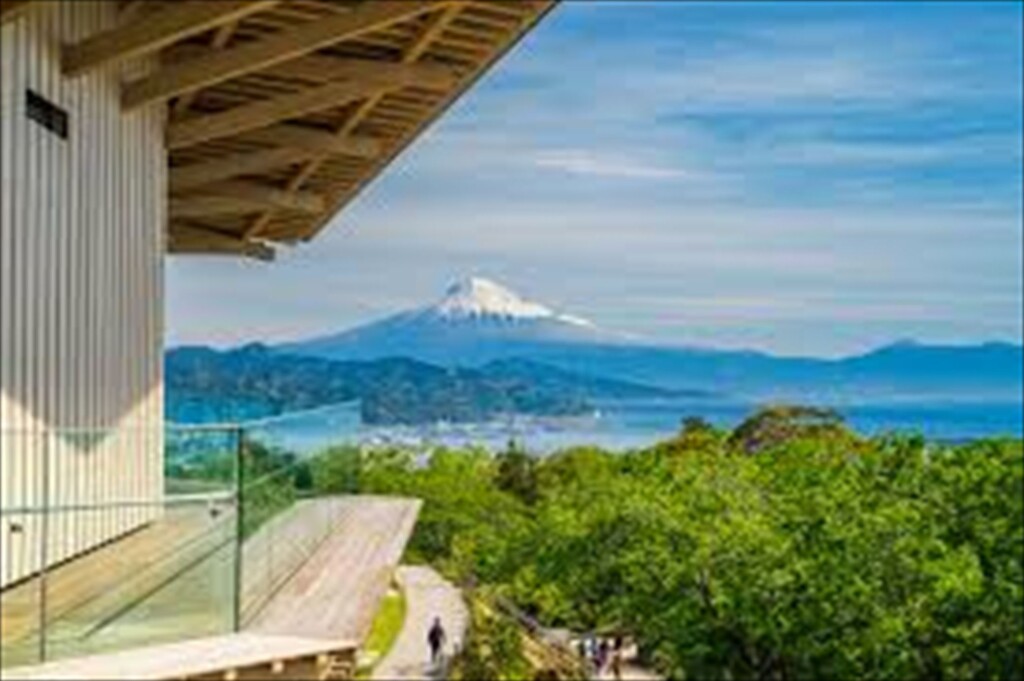 Scenic view of Mount Fuji under a clear blue sky from Nihondaira Yume Terrace observation deck in Shizuoka, Japan.